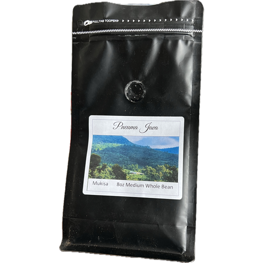 A stylish bag of Ugandan Mukisa robusta coffee, showcasing a sleek design with earthy accents, representing the premium robusta beans grown in central Uganda to promote social change.